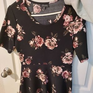 Justify short sleeved black dress with pink roses. Size Medium. Mid-length.